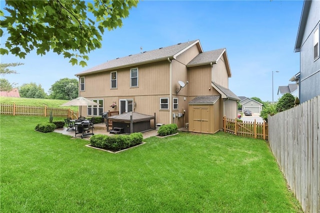 800 Ash Ct, Lansing, KS 66043 - rear view of house with a patio area and a jacuzzi