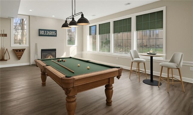 15142 Windsor Cir, Leawood, KS 66224 - game room with dark wood-type flooring, plenty of natural light, billiards table, a glass covered fireplace, and recessed lighting