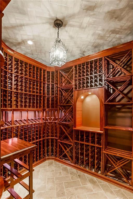 15142 Windsor Cir, Leawood, KS 66224 - wine cellar with stone finish flooring