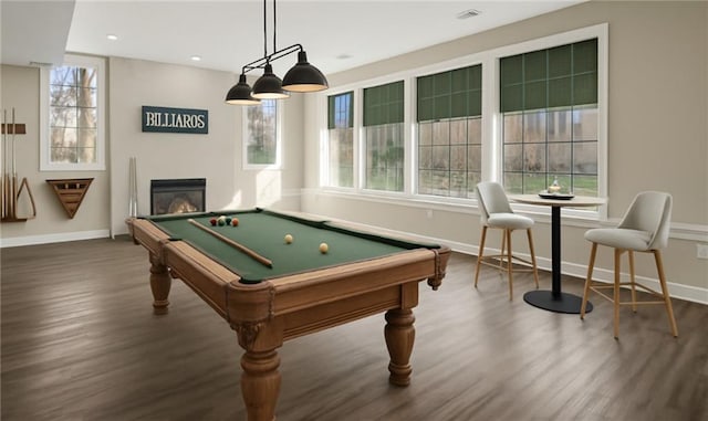 15142 Windsor Cir, Leawood, KS 66224 - playroom with dark wood-style flooring, plenty of natural light, pool table, a glass covered fireplace, and recessed lighting
