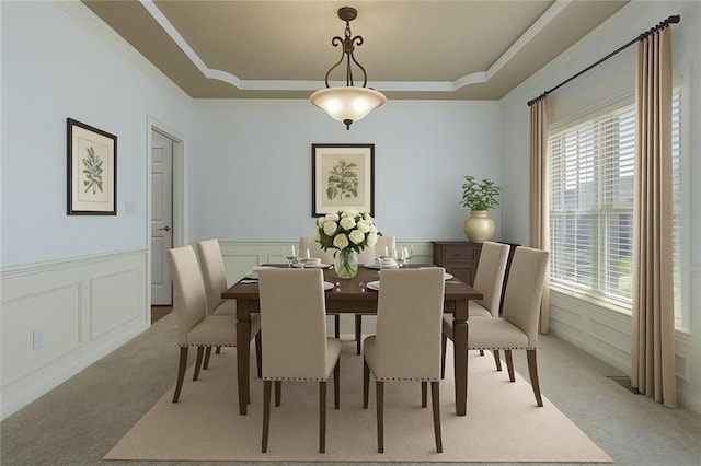 3104 SE 2nd St, Lees Summit, MO 64063 - dining space featuring light carpet, plenty of natural light, crown molding, a tray ceiling, and a decorative wall