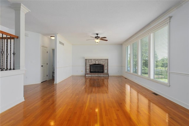 3104 SE 2nd St, Lees Summit, MO 64063 - unfurnished living room featuring ceiling fan, light wood-type flooring, a fireplace, and baseboards