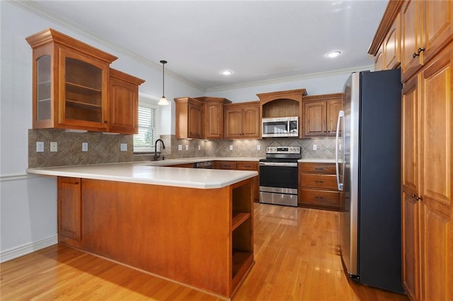3104 SE 2nd St, Lees Summit, MO 64063 - kitchen with appliances with stainless steel finishes, a peninsula, open shelves, light wood finished floors, and crown molding