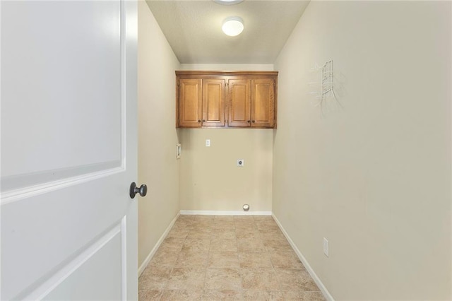 3104 SE 2nd St, Lees Summit, MO 64063 - laundry room with hookup for an electric dryer, baseboards, and cabinet space