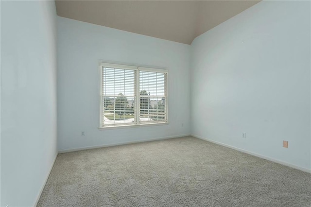 3104 SE 2nd St, Lees Summit, MO 64063 - spare room featuring carpet flooring, baseboards, and lofted ceiling
