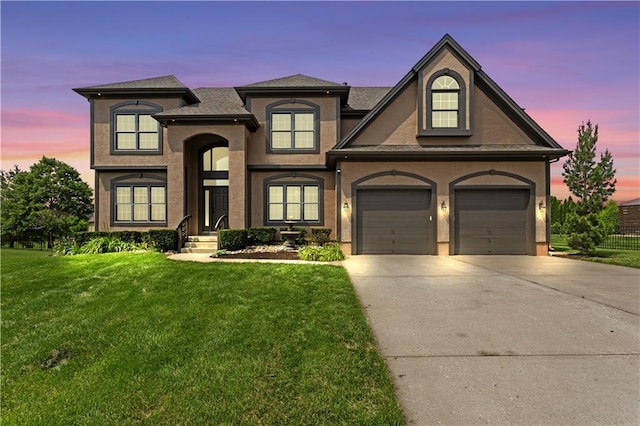 3104 SE 2nd St, Lees Summit, MO 64063 - view of front facade featuring driveway, a front lawn, a garage, and stucco siding