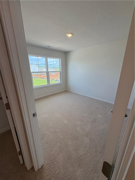 19620 W 201st St, Spring Hill, KS 66083 - empty room with carpet flooring and baseboards