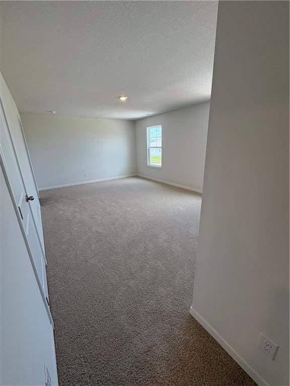 19620 W 201st St, Spring Hill, KS 66083 - empty room with carpet, baseboards, and a textured ceiling
