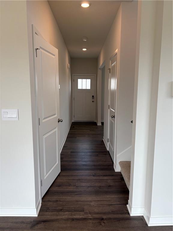 19620 W 201st St, Spring Hill, KS 66083 - hallway featuring dark wood finished floors, baseboards, and recessed lighting