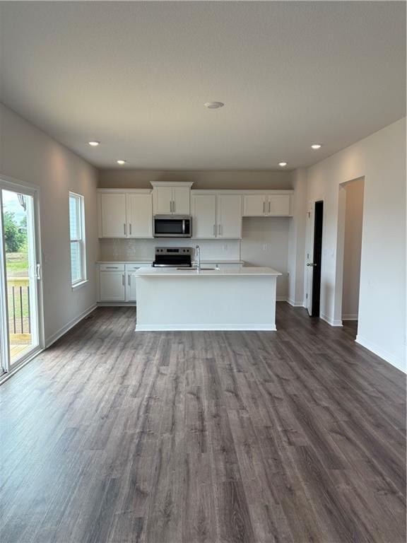 19620 W 201st St, Spring Hill, KS 66083 - kitchen featuring appliances with stainless steel finishes, baseboards, dark wood-type flooring, white cabinets, and recessed lighting