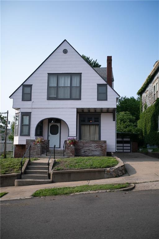 1017 Angelique St, Saint Joseph, MO 64501 - view of front facade with a chimney and covered porch