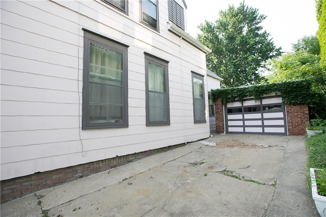1017 Angelique St, Saint Joseph, MO 64501 - view of side of home featuring driveway and an outbuilding