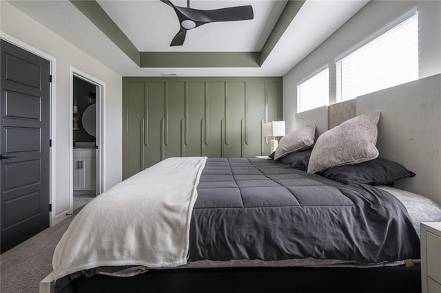 3711 SW Maryville Pl, Lees Summit, MO 64082 - carpeted bedroom featuring connected bathroom and a ceiling fan
