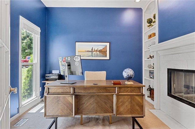 9816 W 132nd Ter, Overland Park, KS 66213 - office space featuring built in shelves, a tile fireplace, and baseboards
