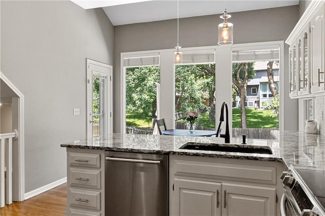 9816 W 132nd Ter, Overland Park, KS 66213 - kitchen featuring stainless steel appliances, a sink, healthy amount of natural light, and white cabinetry
