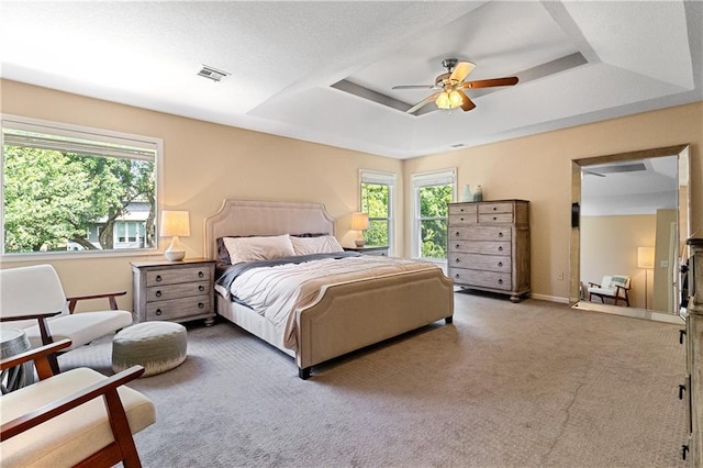 9816 W 132nd Ter, Overland Park, KS 66213 - carpeted bedroom with a tray ceiling, baseboards, and ceiling fan