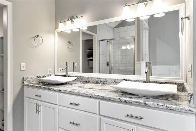 9816 W 132nd Ter, Overland Park, KS 66213 - bathroom featuring double vanity and a shower stall