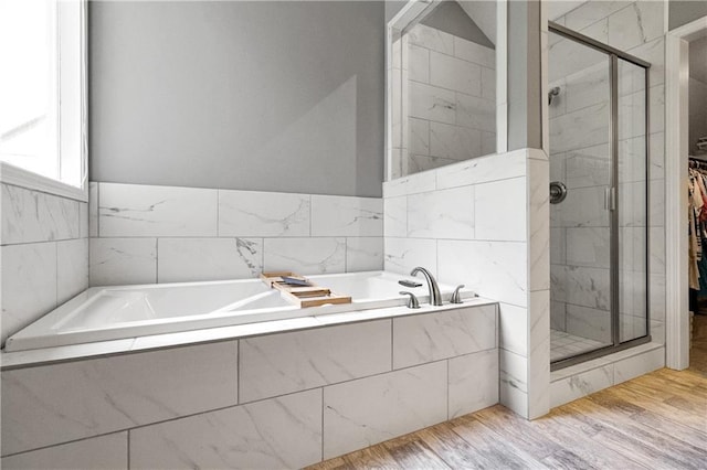 9816 W 132nd Ter, Overland Park, KS 66213 - full bath featuring a shower stall, a bath, a spacious closet, and wood finished floors