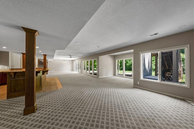 4829 W 144th Ter, Leawood, KS 66224 - spare room featuring carpet, decorative columns, baseboards, recessed lighting, and a textured ceiling