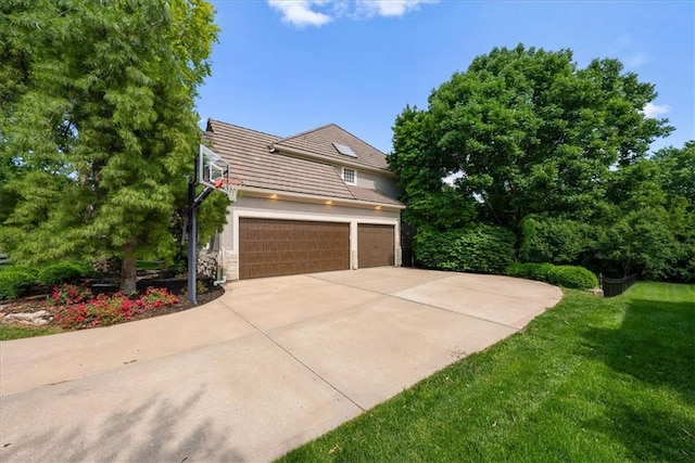 4829 W 144th Ter, Leawood, KS 66224 - view of front of house featuring driveway, a tiled roof, a front yard, stone siding, and stucco siding