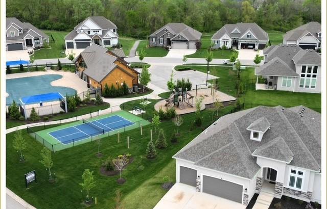 2055 NW Obrien Rd, Lees Summit, MO 64081 - aerial perspective of suburban area featuring a pool