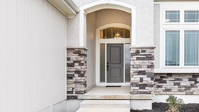 2055 NW Obrien Rd, Lees Summit, MO 64081 - property entrance featuring stone siding