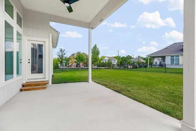 2055 NW Obrien Rd, Lees Summit, MO 64081 - fenced backyard featuring ceiling fan, a patio, a residential view, and entry steps