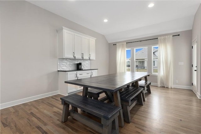 2055 NW Obrien Rd, Lees Summit, MO 64081 - dining room featuring light wood-type flooring, lofted ceiling, and recessed lighting