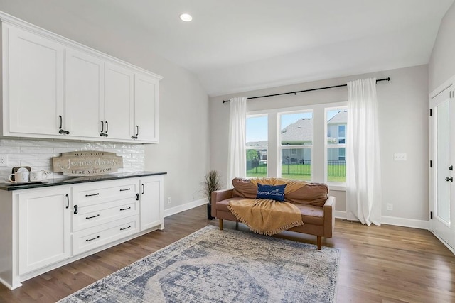 2055 NW Obrien Rd, Lees Summit, MO 64081 - sitting room with vaulted ceiling, wood finished floors, and recessed lighting