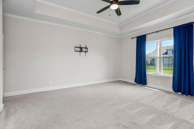 2055 NW Obrien Rd, Lees Summit, MO 64081 - spare room with a raised ceiling, carpet flooring, a ceiling fan, and ornamental molding