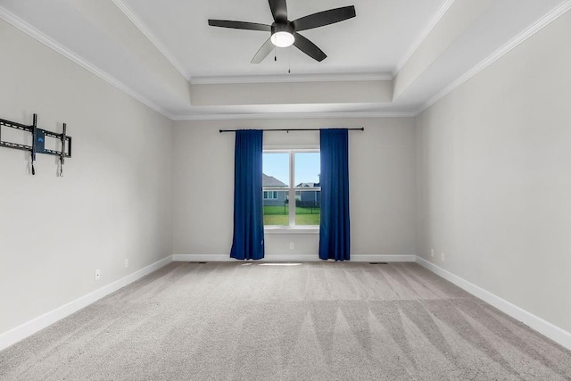 2055 NW Obrien Rd, Lees Summit, MO 64081 - empty room with a raised ceiling, carpet floors, crown molding, and ceiling fan