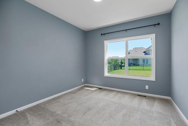 2055 NW Obrien Rd, Lees Summit, MO 64081 - carpeted empty room featuring baseboards