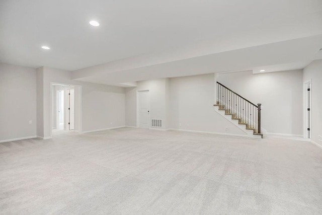 2055 NW Obrien Rd, Lees Summit, MO 64081 - finished basement with light carpet, stairs, and recessed lighting