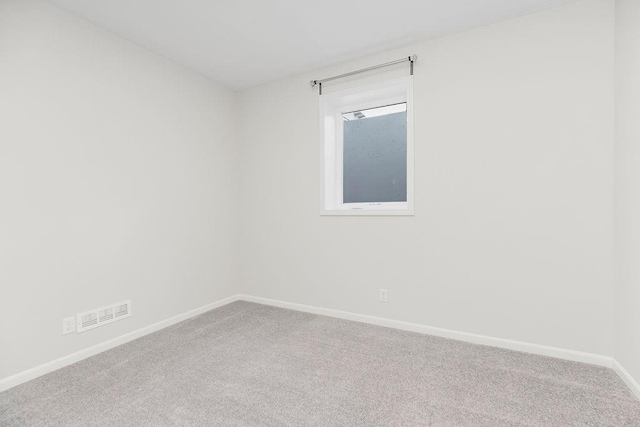 2055 NW Obrien Rd, Lees Summit, MO 64081 - carpeted spare room featuring baseboards