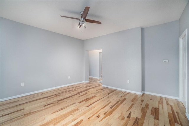 412 Montgall Ave, Kansas City, MO 64124 - spare room featuring ceiling fan, light wood-type flooring, and baseboards