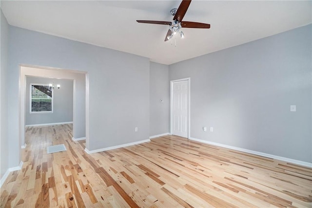 412 Montgall Ave, Kansas City, MO 64124 - unfurnished room featuring light wood finished floors, ceiling fan, and baseboards