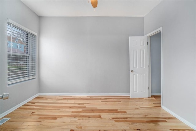 412 Montgall Ave, Kansas City, MO 64124 - empty room with wood finished floors and baseboards