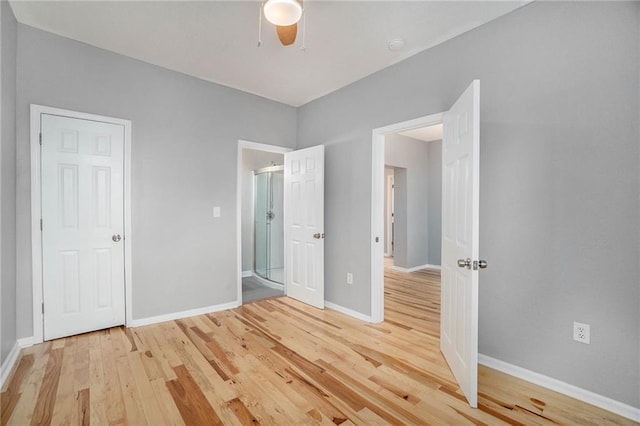 412 Montgall Ave, Kansas City, MO 64124 - unfurnished bedroom featuring wood finished floors, baseboards, and ceiling fan
