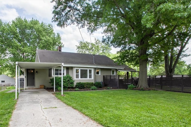 5818 W 75th St, Prairie Village, KS 66208 - view of front facade featuring driveway, a carport, and a chimney