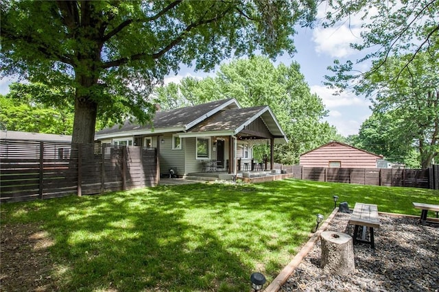 5818 W 75th St, Prairie Village, KS 66208 - back of house featuring covered porch