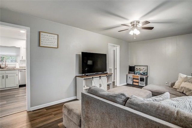 12500 E 48th Ter S, Independence, MO 64055 - living room featuring dark wood-style floors, a ceiling fan, and baseboards