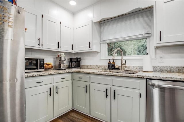 12500 E 48th Ter S, Independence, MO 64055 - kitchen featuring stainless steel appliances, a sink, white cabinets, light stone counters, and recessed lighting