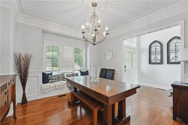 1040 Silverleaf Ln, Liberty, MO 64068 - dining space featuring ornamental molding, a chandelier, and wood-type flooring