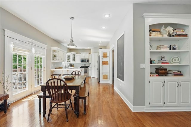 1040 Silverleaf Ln, Liberty, MO 64068 - dining area featuring light wood-style flooring, baseboards, and recessed lighting
