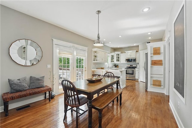 1040 Silverleaf Ln, Liberty, MO 64068 - dining area with wood finished floors, recessed lighting, and baseboards