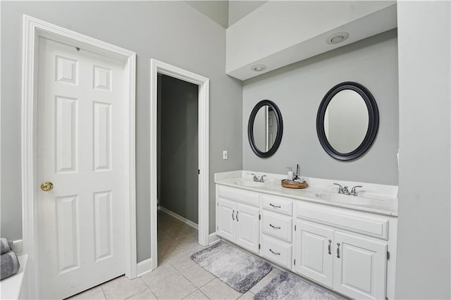 1040 Silverleaf Ln, Liberty, MO 64068 - bathroom featuring double vanity, tile patterned flooring, and baseboards