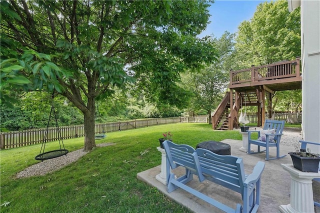 1040 Silverleaf Ln, Liberty, MO 64068 - view of yard featuring a fire pit, a patio, stairway, view of wooded area, and a deck