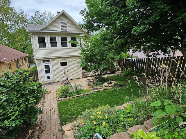 back of property with a patio