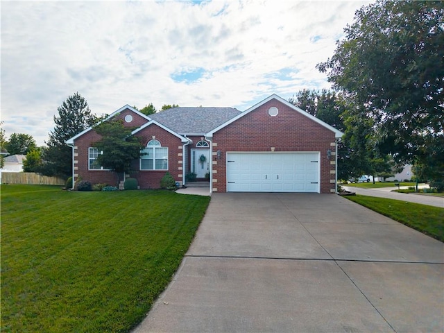 3100 Clarendon Rd, Sedalia, MO 65301 - view of front of property featuring concrete driveway, an attached garage, and brick siding
