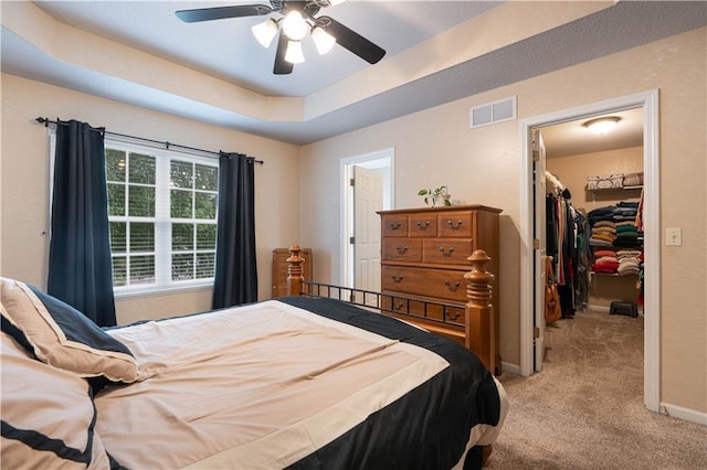3100 Clarendon Rd, Sedalia, MO 65301 - bedroom with light colored carpet, a spacious closet, a closet, baseboards, and a raised ceiling